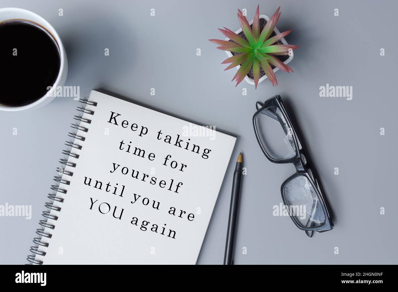 Motivational and inspirational quote on notepad - Keep taking time for yourself until you are you again Stock Photo
