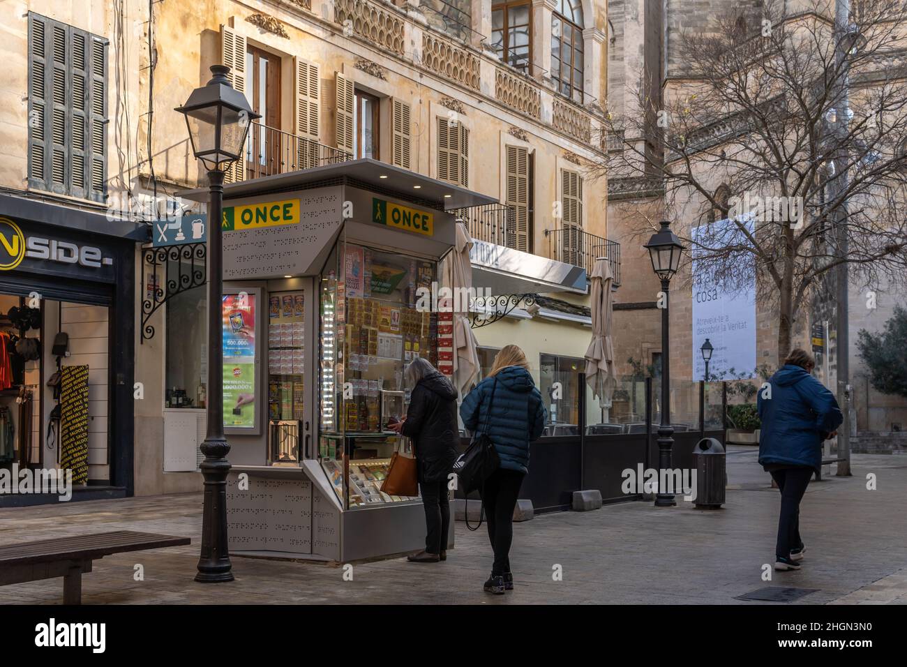 Manacor, Spain; january 20 2022: Lottery kiosk of the Spanish National Organization fot the Blind, ONCE, in the historic center of Manacor. People wea Stock Photo