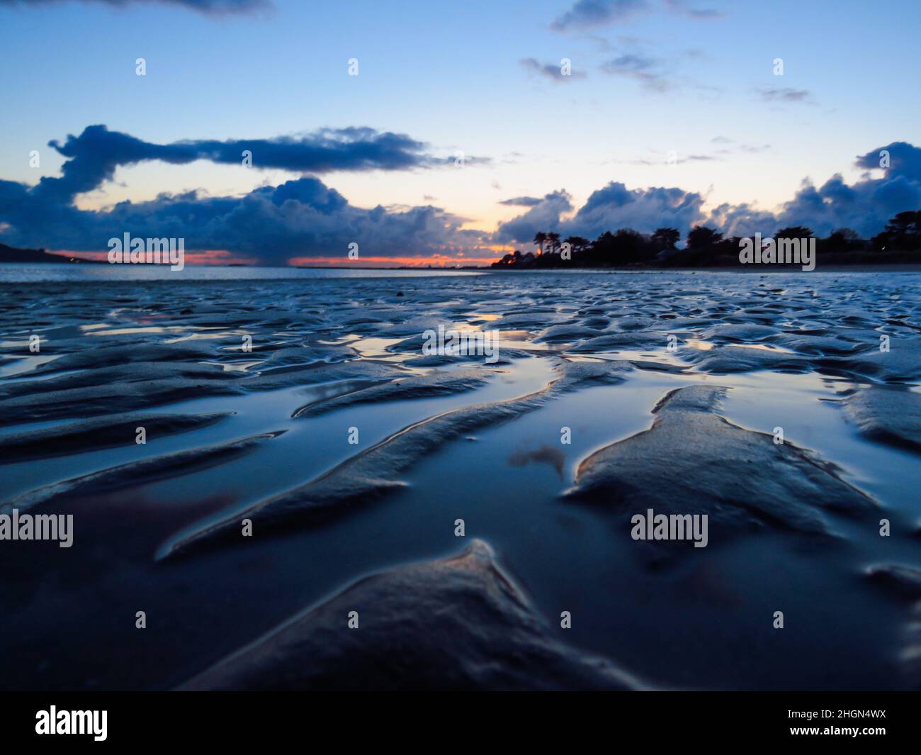 Ripples in the sand at relatively low tide at Burrow Beach on a mid ...