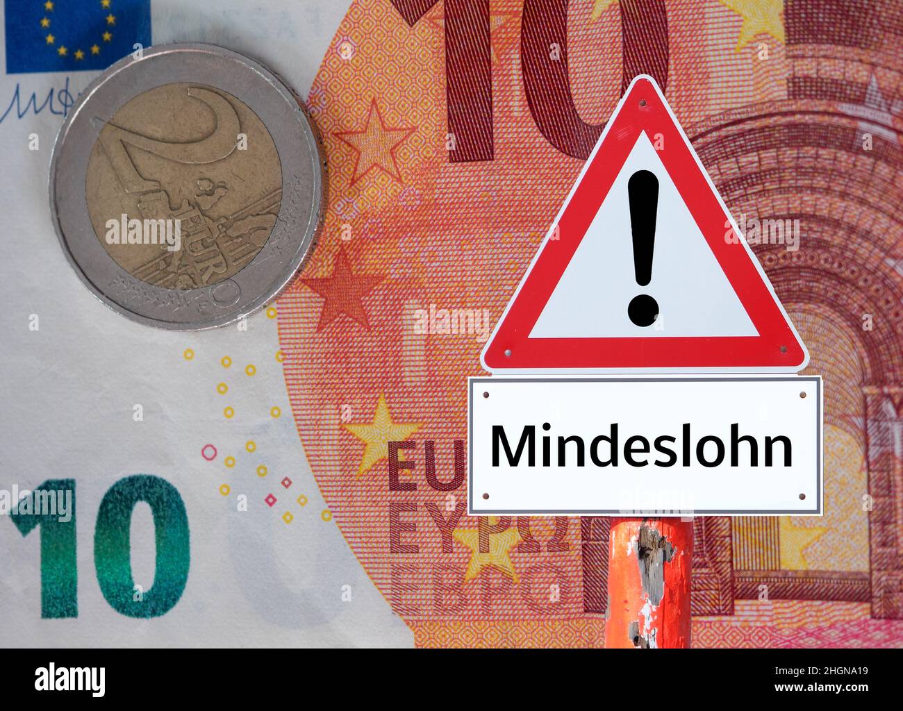 Warning sign minimum wage in Germany Stock Photo Alamy