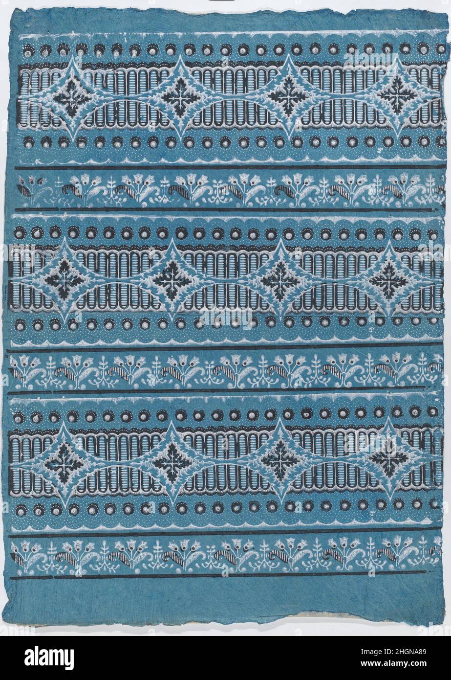 Sheet with four borders with a floral, dot, and stripe pattern late ...