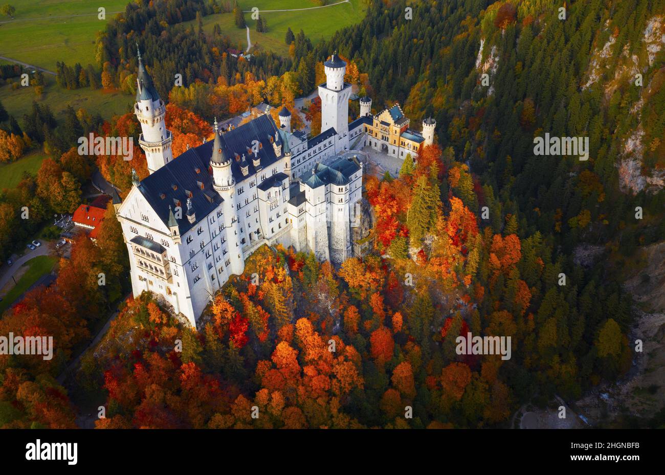 Famous Neuschwanstein Castle in Autumn colours, Germany, Bavaria, Hohenschwangau Stock Photo