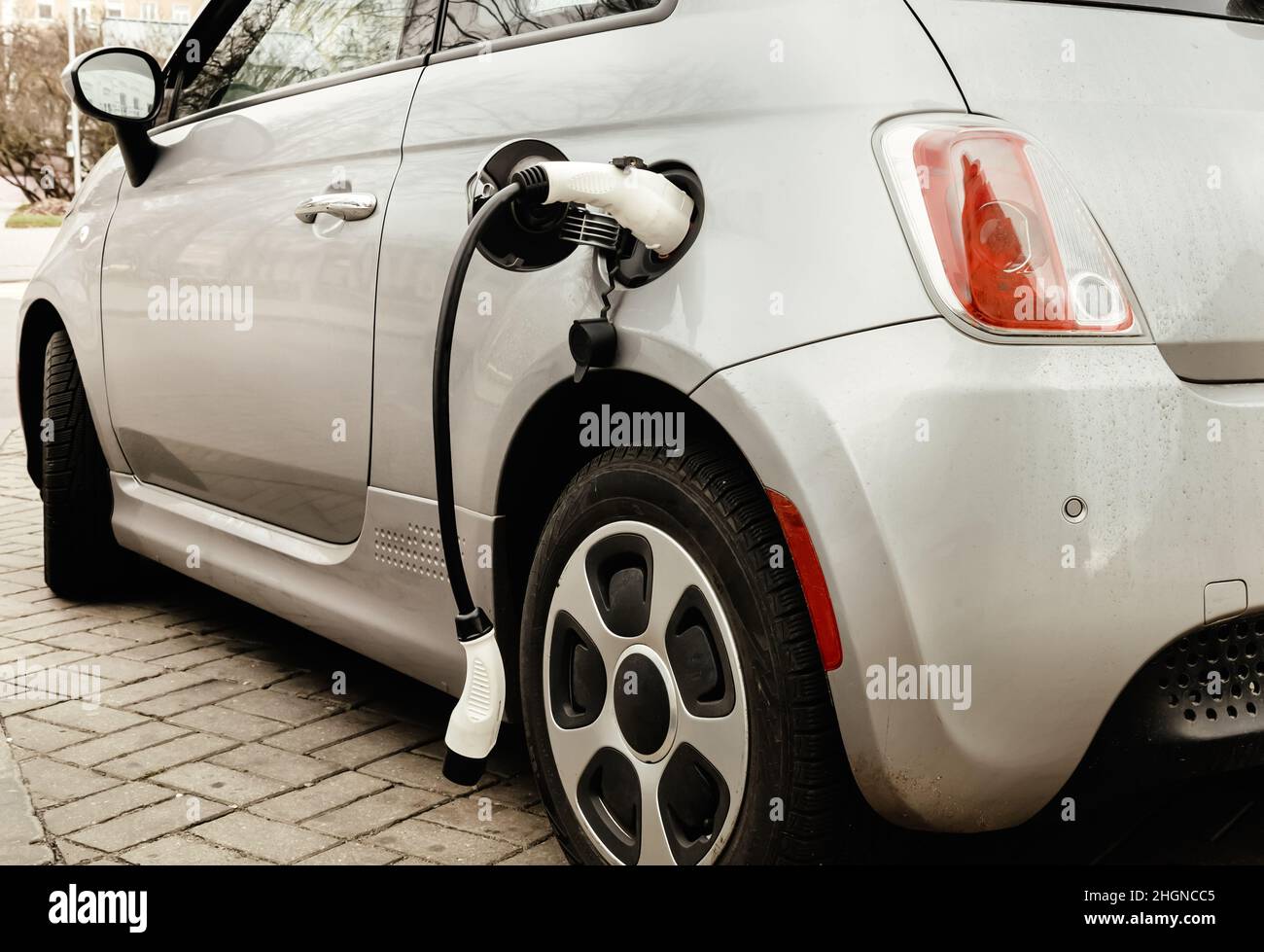 Electric car at the charging station. Ecology. Eco-friendly transport ...