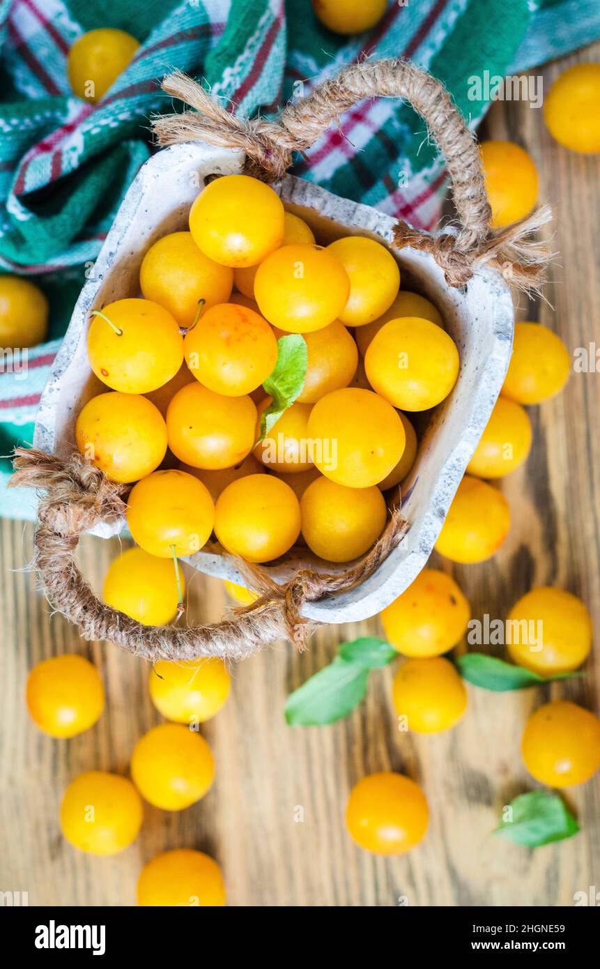Yellow fresh cherry plum on the table Stock Photo