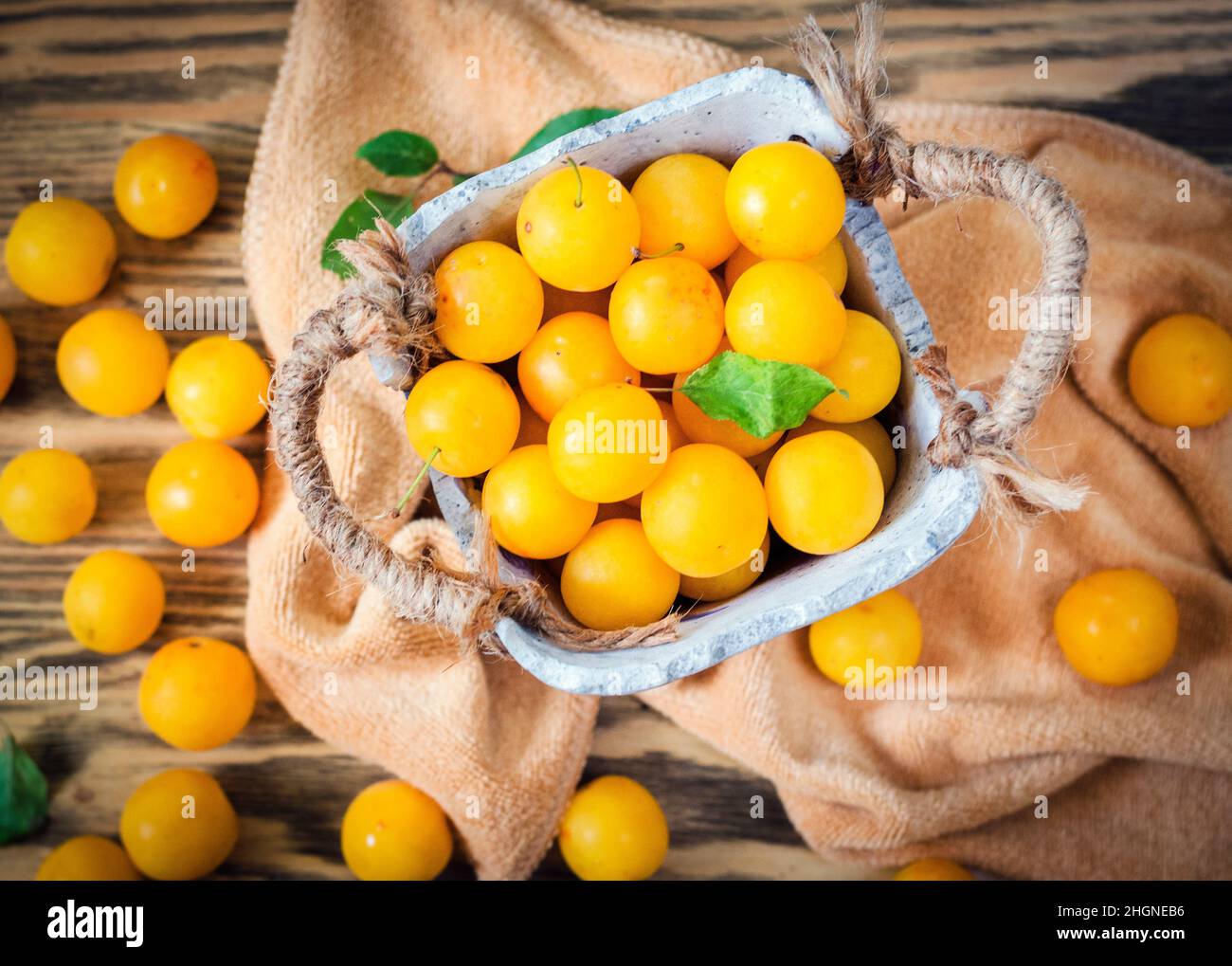 Yellow fresh cherry plum on the table Stock Photo