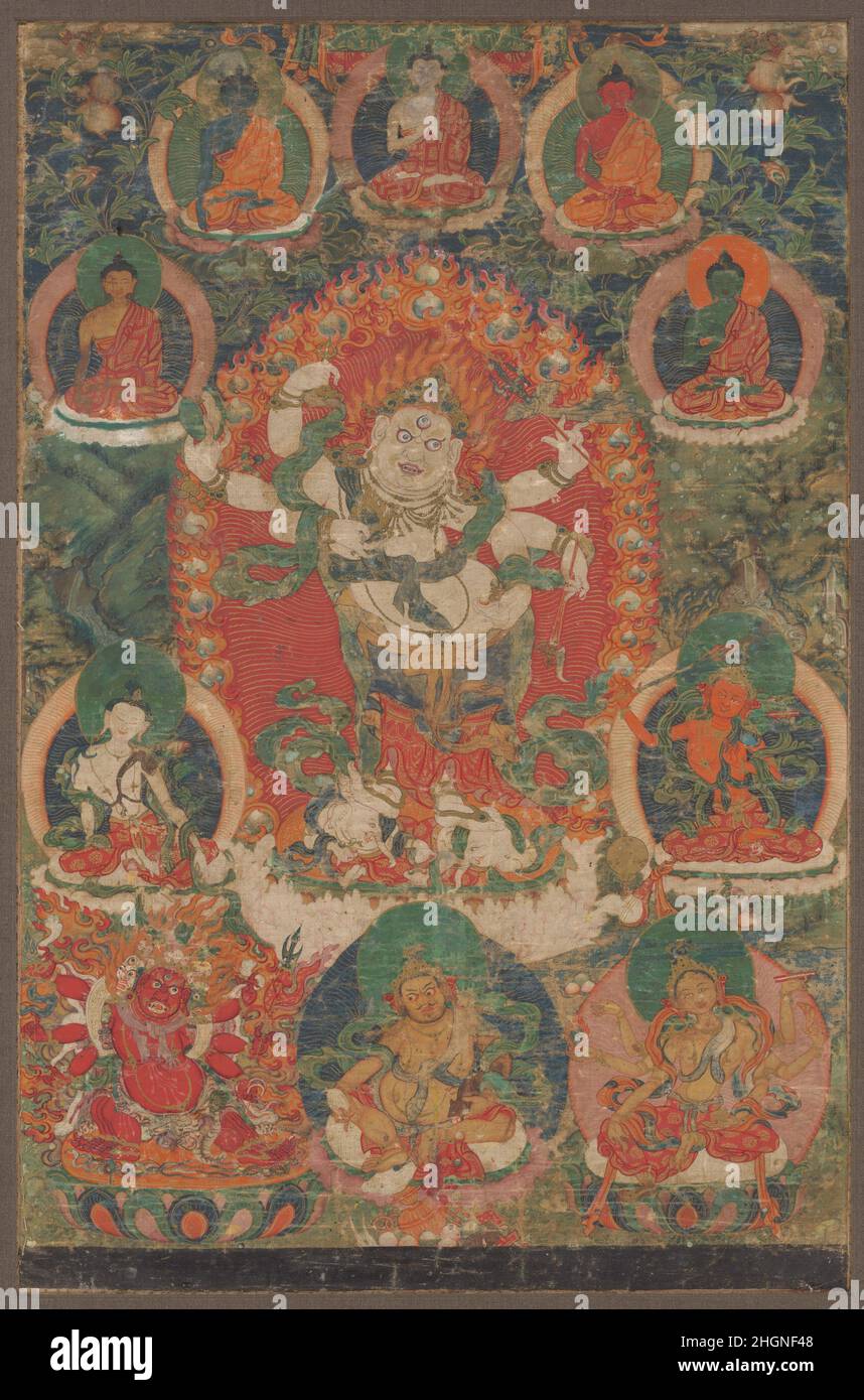 White Mahakala ca. 18th century Tibet This painting is dedicated to Shadbuja Sita Mahakala, the White Mahakala, a wealth deity invoked widely by Tibetan Buddhists to ensure prosperity. Mahakala is depicted with three wide glaring and fearsome eyes, and six arms wielding power weapons. The wrathful protector is surrounded by an array of auspicious and protective deities, presided over by the five Transcendent Buddhas.. White Mahakala. Tibet. ca. 18th century. Distemper on cotton. Paintings Stock Photo