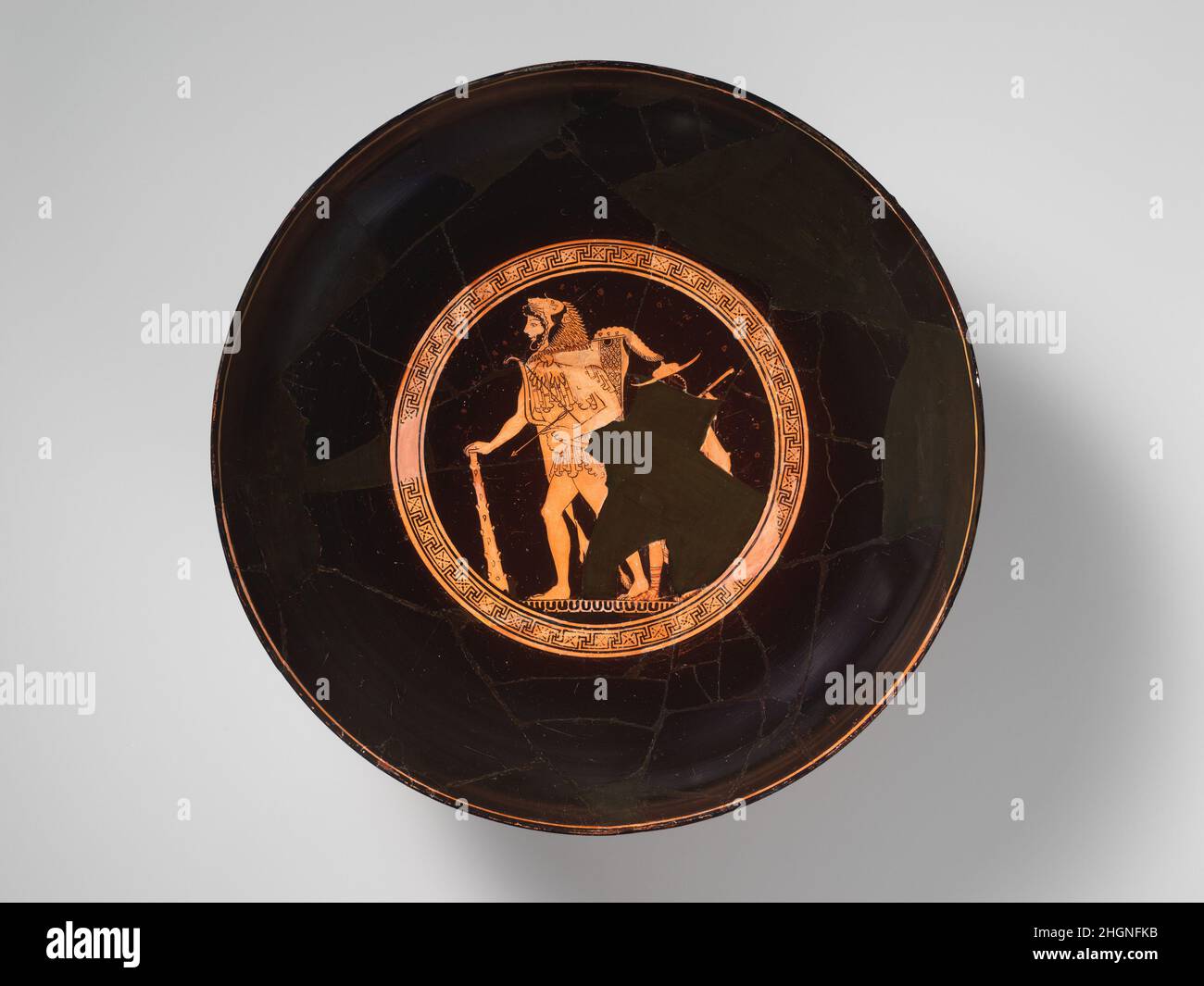 Terracotta kylix (drinking cup) ca. 490 B.C. Signed by Euphronios Interior, Herakles and young boyExterior, Herakles fighting the sons of Eurytos; Herakles fighting OpsEuphronios is probably the best known of the early red-figure artists called the Pioneers. During the latter part of his career, he signs as potter rather than painter, and he collaborates with various painters of whom Onesimos is one of the most accomplished. The representation on the interior shows the almost coloristic effects that Onesimos achieved with dilute glaze as well as his marvelous characterization of Herakles—young Stock Photo