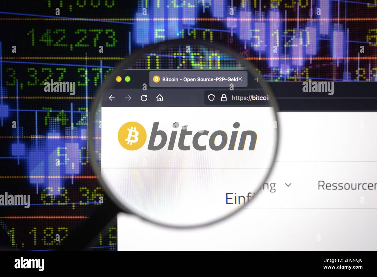 Bitcoin crypto company logo on a website, seen on a computer screen through  a magnifying glass Stock Photo - Alamy