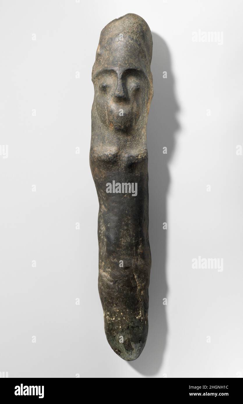 Axe 10th–15th century Taíno This stone, axe handle-shaped figure may have been a ceremonial scepter created by Taíno peoples, the diverse societies that inhabited the Antilles archipelago before European contact. The most numerous category of polished stone sculpture emerging from the Taíno world of the ancestral Caribbean islands are ceremonial axes and blades, which take many forms and may have been an important medium of exchange. Axes feature abstract zoomorphic forms in stone, or consisted of wooden handles with stone blades hafted to them. Ceremonial blades made of different types of gre Stock Photo