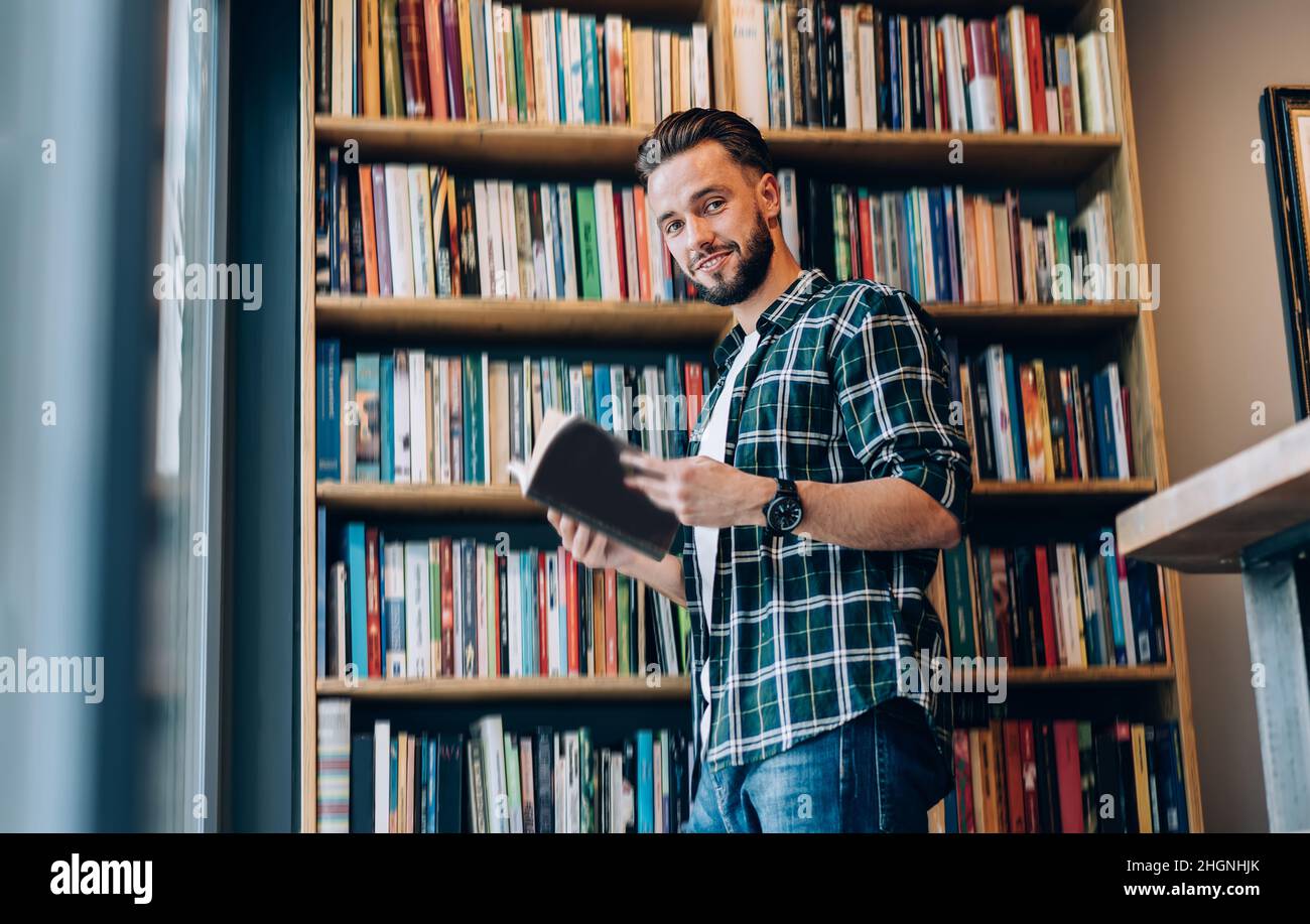 knowledge and wisdom education concept. man in library Stock Photo