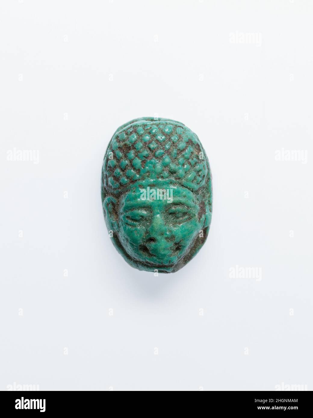 Human Head Scaraboid ca. 1295–1070 B.C. New Kingdom, Ramesside. Human Head Scaraboid. ca. 1295–1070 B.C.. Faience. New Kingdom, Ramesside. From Egypt. Dynasty 19–20 Stock Photo