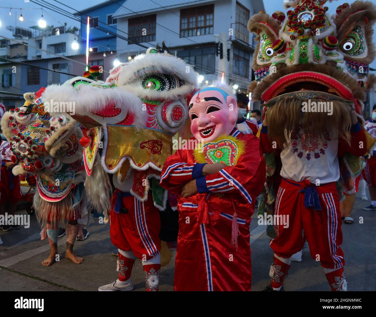 Lion dancers in the street in Chinatown, Bangkok,Thailand Stock Photo