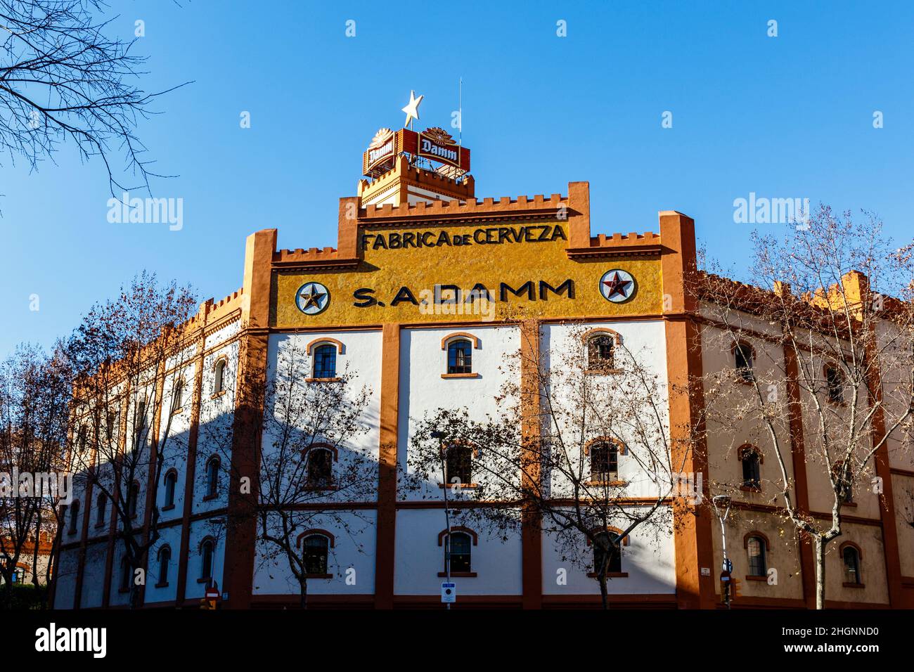 Facade of the Estrella Damm beer brewery (Fabrica de Cerveza in Spanish) in el Eixample in Barcelona, Catalonia, Spain, Europe Stock Photo