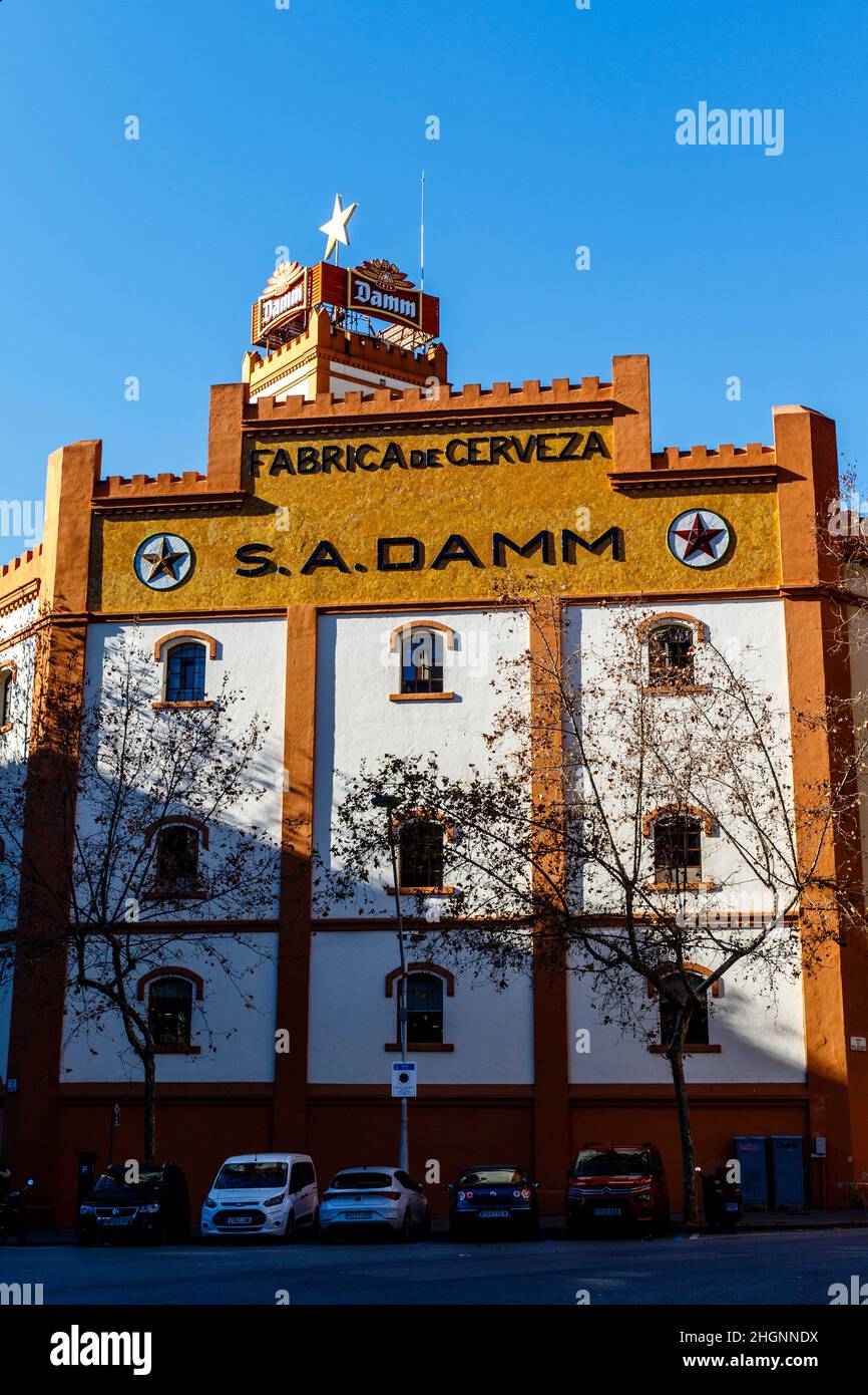 Facade of the Estrella Damm beer brewery (Fabrica de Cerveza in Spanish) in el Eixample in Barcelona, Catalonia, Spain, Europe Stock Photo