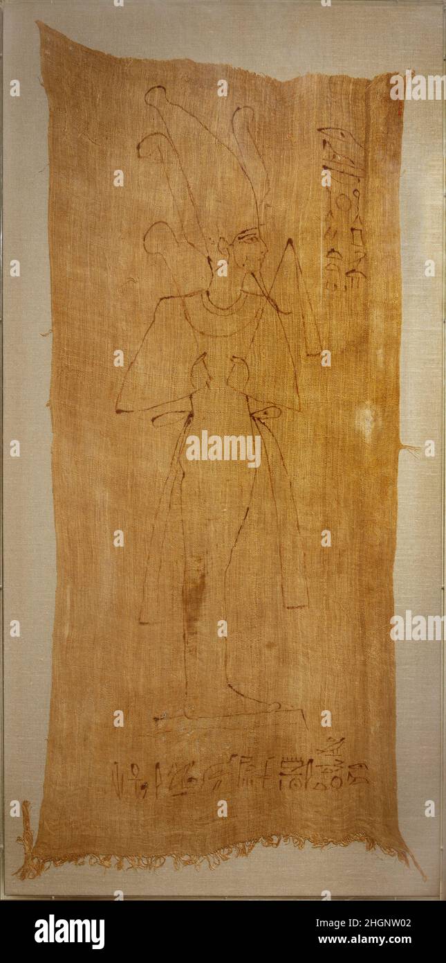 Osiris Shroud of Djedimutesankh ca. 1070–945 B.C. Third Intermediate Period After the process of of wrapping the mummy of the Priestess of Amun Djedmutesankh was completed, this shroud, bearing a full length figure of the deity Osiris, was placed over the bandages and tied behind the body with cords specially woven into the fabric for this purpose. Once this was in place, the mummy was sewed into a plain outer sheet adorned with tapes. The shroud served to identify the deceased with the great god, Ruler of the Netherworld.On the shroud are two lines of text. Before the god is: 'Osiris, Lord of Stock Photo