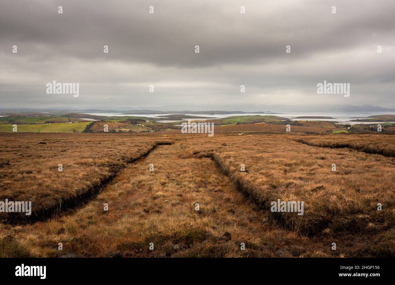 Traces of turfcutting in the vast peatlands between Mulrany and Newport in county Mayo. Stunning views of Clew Bay in the distance Stock Photo