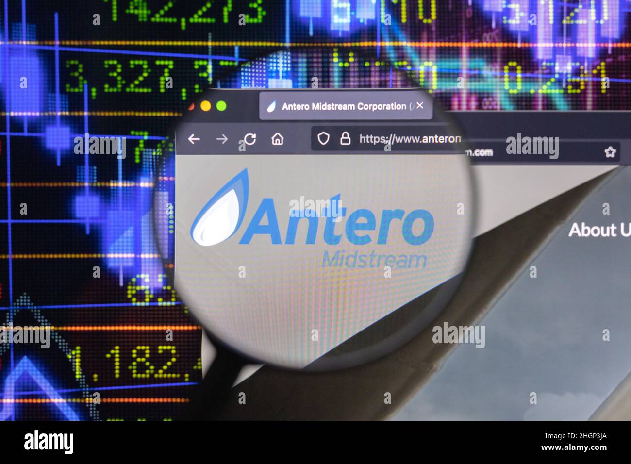 Antero company logo on a website with blurry stock market developments in the background, seen on a computer screen through a magnifying glass. Stock Photo