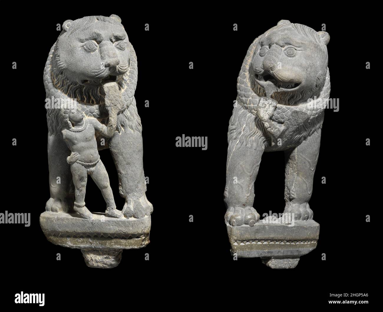 Pair of Lions with Attendant 3rd–5th century Pakistan (ancient region of Gandhara) Such lions are often seen as components of the bases of late Gandharan images.. Pair of Lions with Attendant. Pakistan (ancient region of Gandhara). 3rd–5th century. Schist. Sculpture Stock Photo