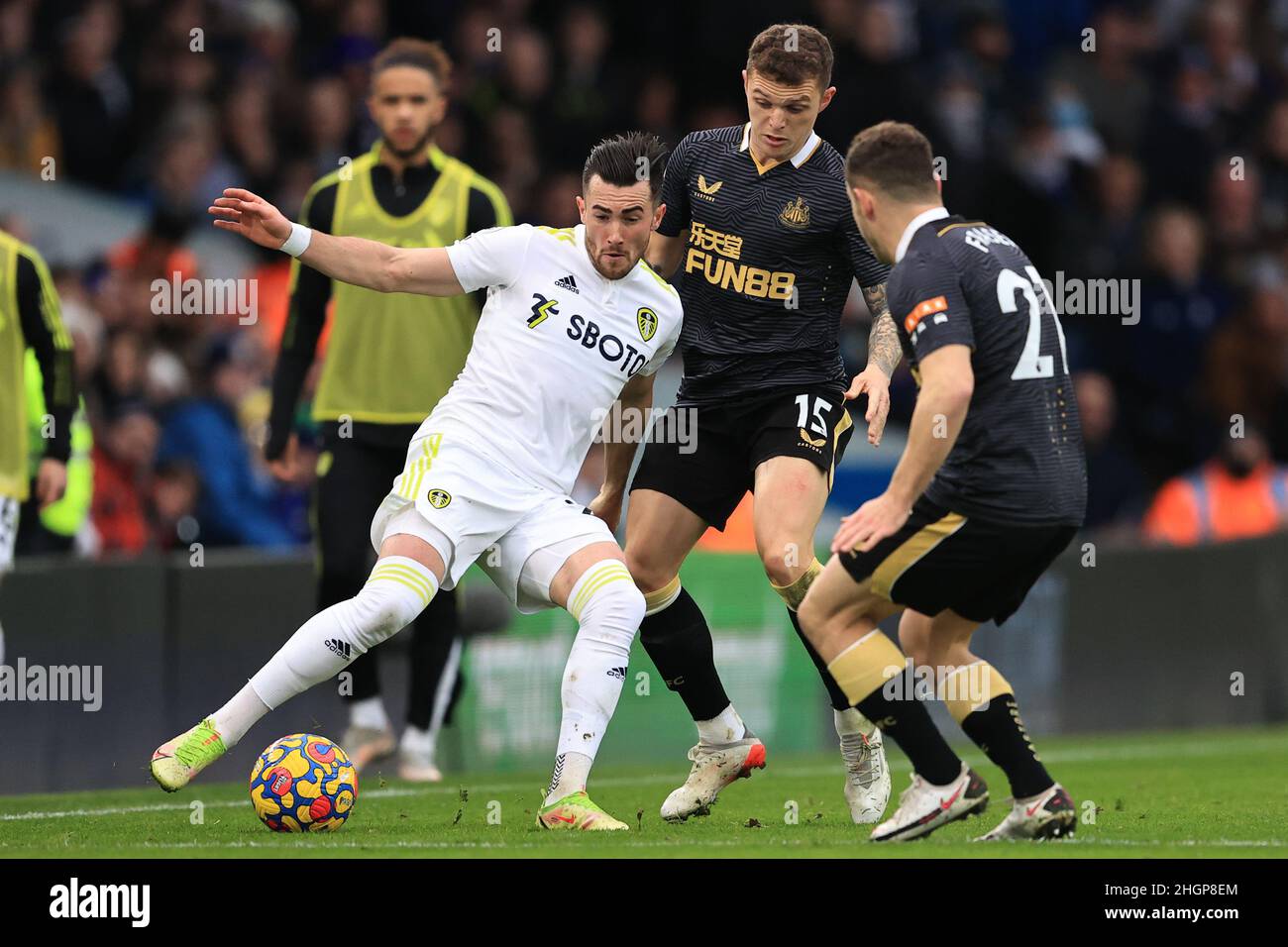 Leeds, UK. 22nd Jan, 2022. Jack Harrison #22 of Leeds United holds the ball from Ryan Fraser #21 of Newcastle United and Kieran Trippier #15 of Newcastle United during the Premier League fixture Leeds United vs Newcastle United at Elland Road, Leeds, UK, 22nd January 2022 Credit: News Images /Alamy Live News Stock Photo