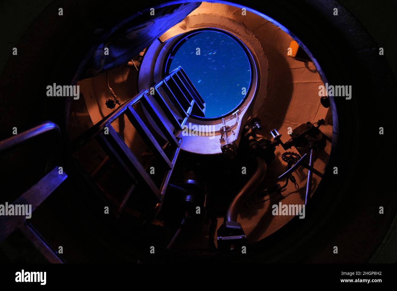 A view looking the stars from inside the open hatch of an Ohio class US Navy submarine. Stock Photo