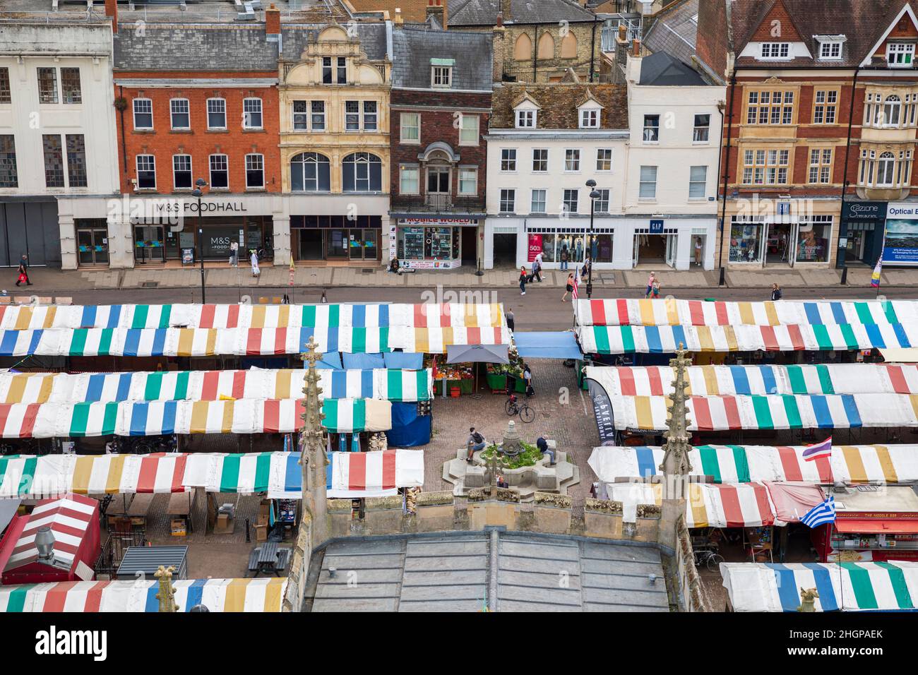 Colourful market stalls in Market Hill, Cambridge, England, as seen