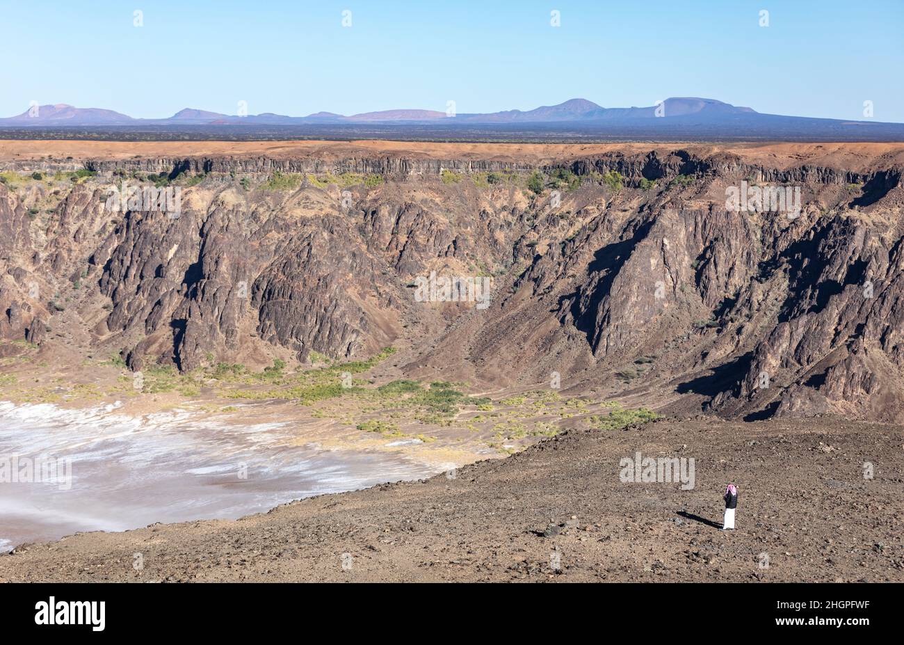 saudi man at the dormant Wahba crater in Saudi Arabia Stock Photo