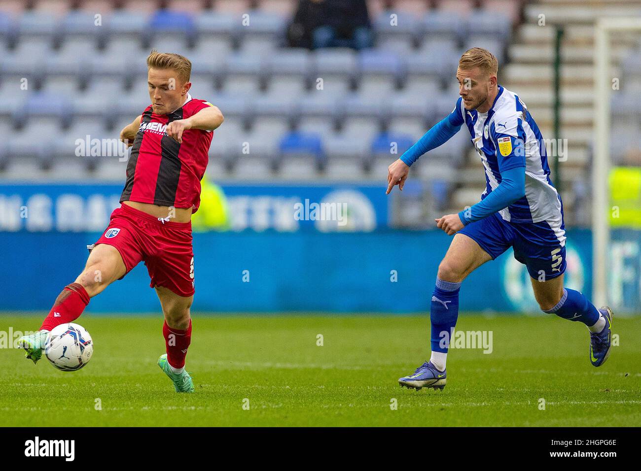 Wigan, UK. 22nd Jan, 2022. Kyle Dempsey 8 of Gillingham tackled by