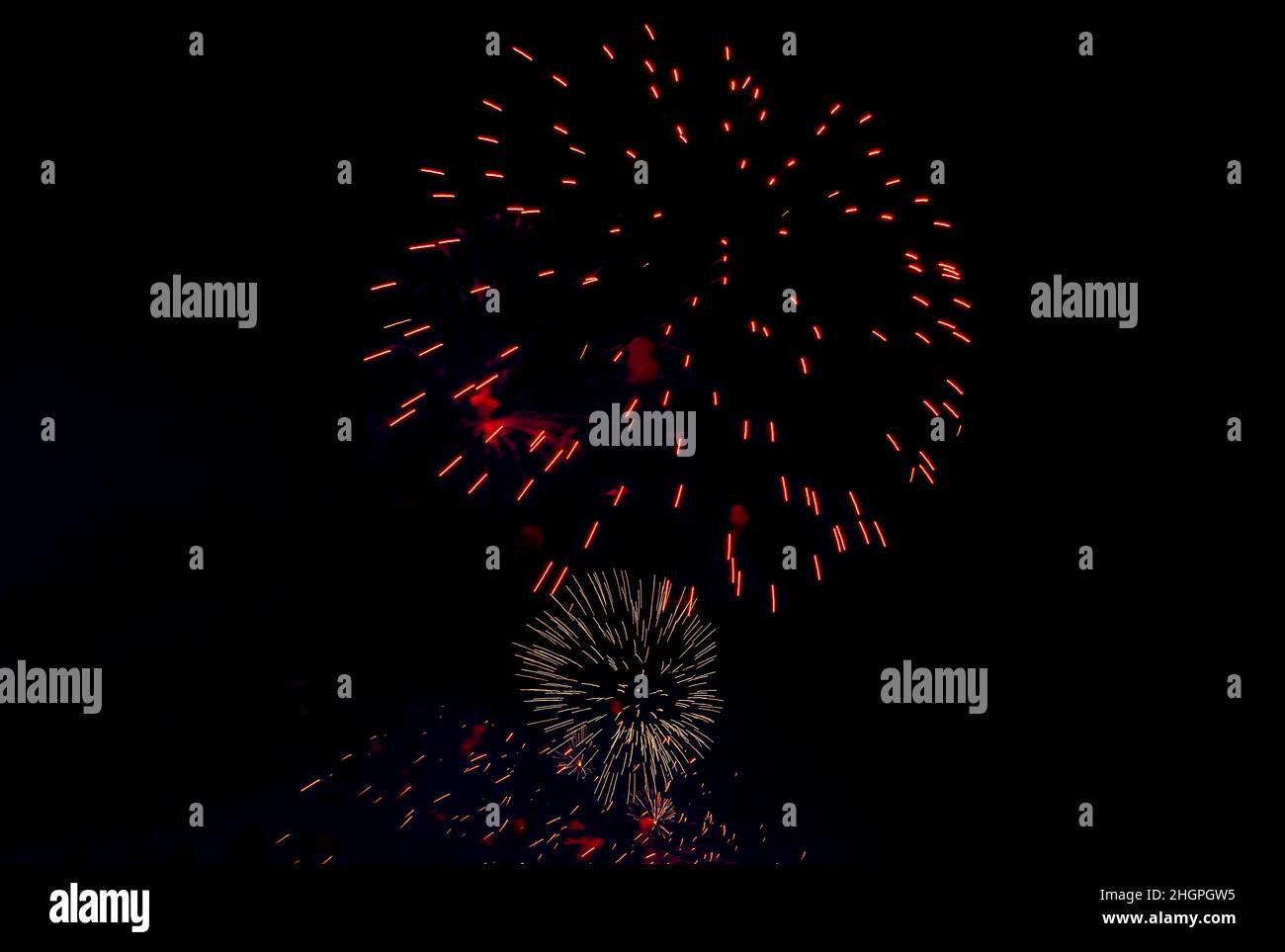 Backgrounds from festive fireworks. Fireworks in the night sky in honor of Victory Day. Stock Photo