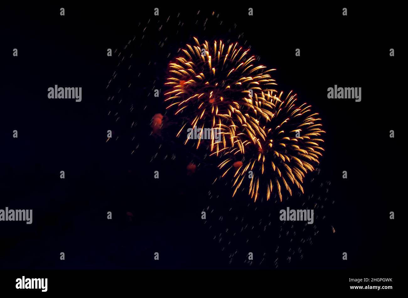 Backgrounds from festive fireworks. Fireworks in the night sky in honor of Victory Day. Stock Photo