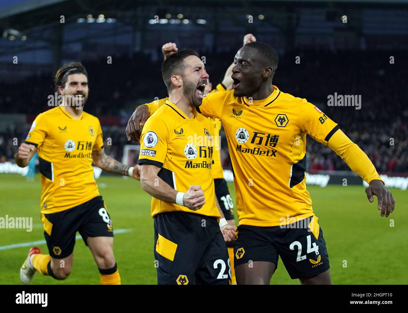 Wolverhampton Wanderers' Joao Moutinho celebrates scoring the opening goal during the Premier League match at Brentford Community Stadium, London. Picture date: Saturday January 22, 2022. Stock Photo