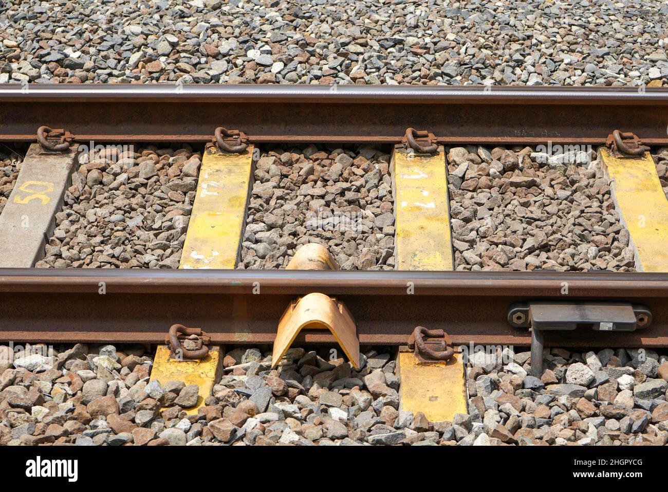 A railway track (British English and UIC terminology) or railroad track (American English), also known as permanent way or simply track, is the struct Stock Photo