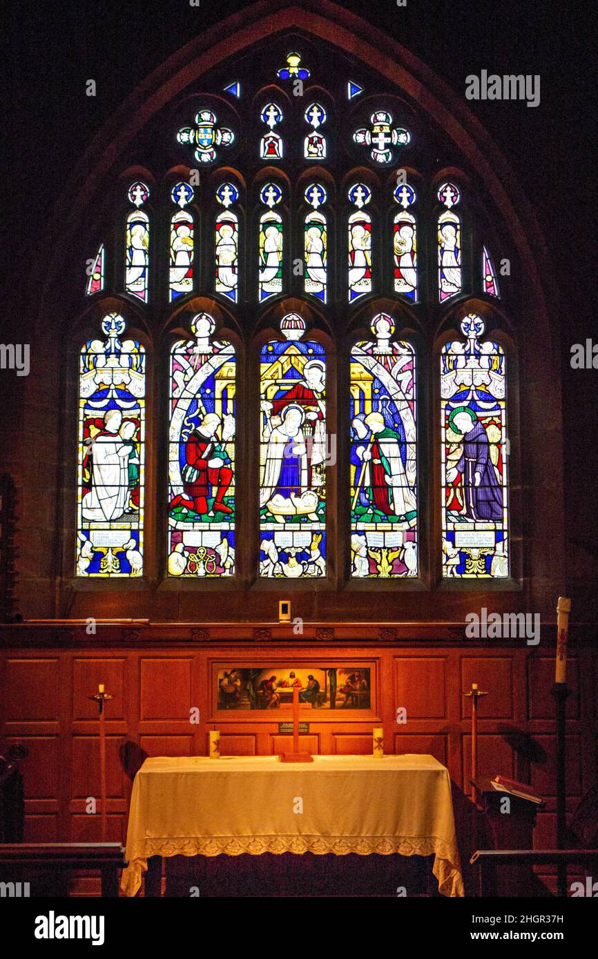 Stained glass windows depicting characters from Alice's Adventures in Wonderland at .All Saints' Church is in the village of Daresbury,  Cheshire, Stock Photo
