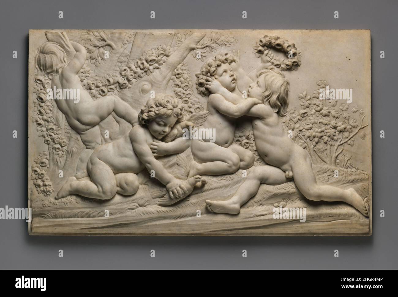 Spring (one of a set of four) probably mid-18th century After a model by Edme Bouchardon French This set of four Seasons (35.104.1–.4) are copies at reduced scale of limestone reliefs on Bouchardon's fountain in the rue de Grenelle, Paris, commissioned in 1735 and finished in 1745.. Spring (one of a set of four). After a model by Edme Bouchardon (French, Chaumont 1698–1762 Paris). French. probably mid-18th century. Marble. Sculpture Stock Photo