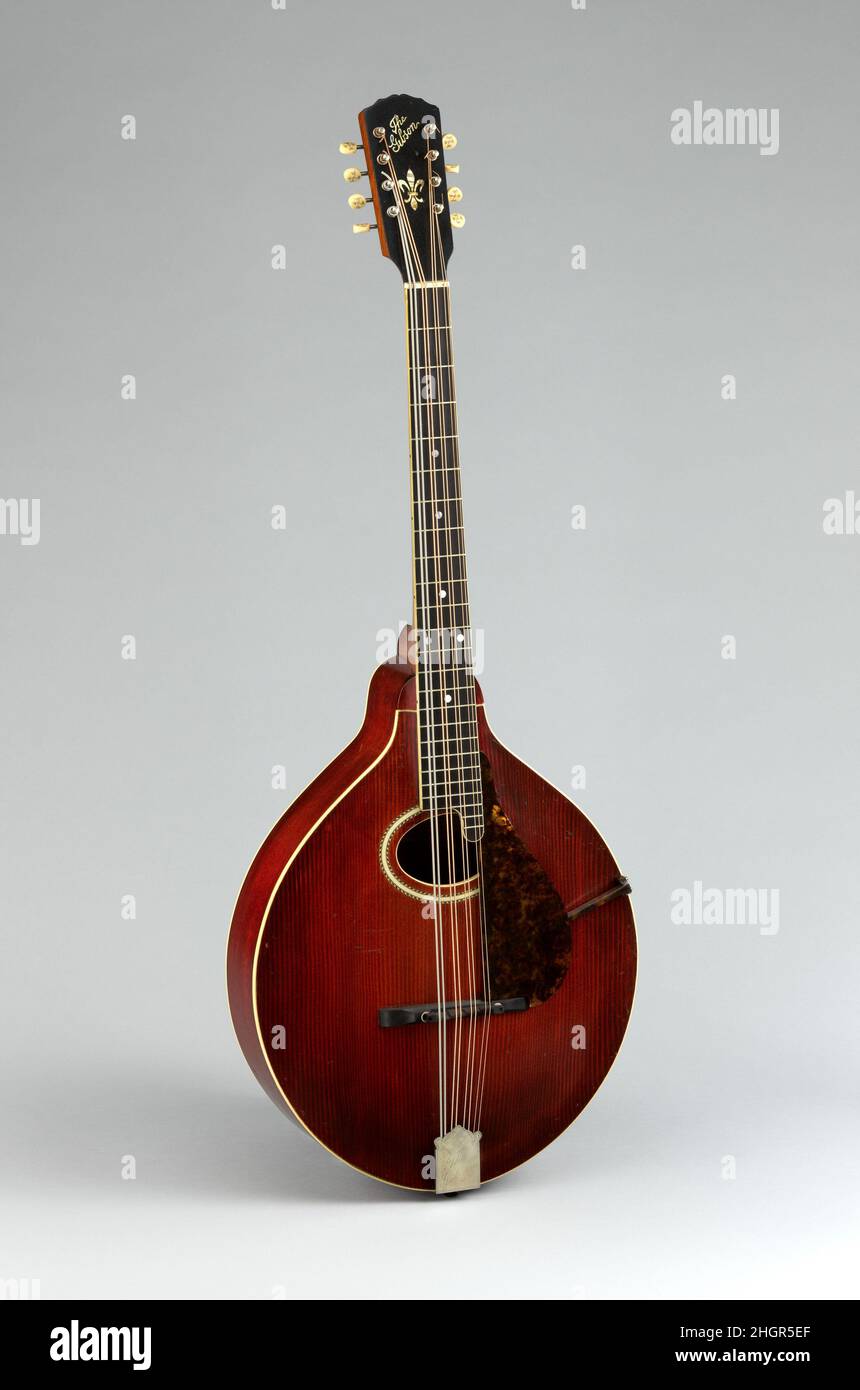 Mandocello 1916 Gibson Mandolin-Guitar Manufacturing Co., Ltd. Gibson K-2  model mandocello with a light to dark red sunburst finish, serial number  25254. The K-2 model mandola has a teardrop shaped body (like