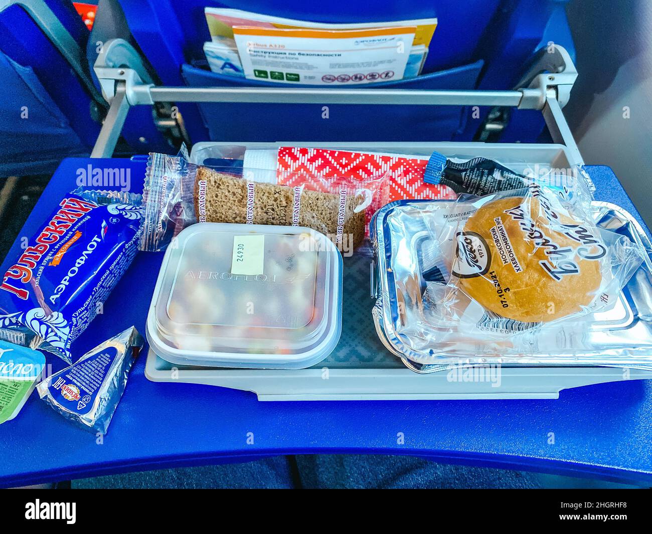 Moscow, Russia - 08.10.2021: Passenger's meal in Aeroflot airplane during  the flight. Hot lunch on the blue seat table. Hight quality photo Stock  Photo - Alamy