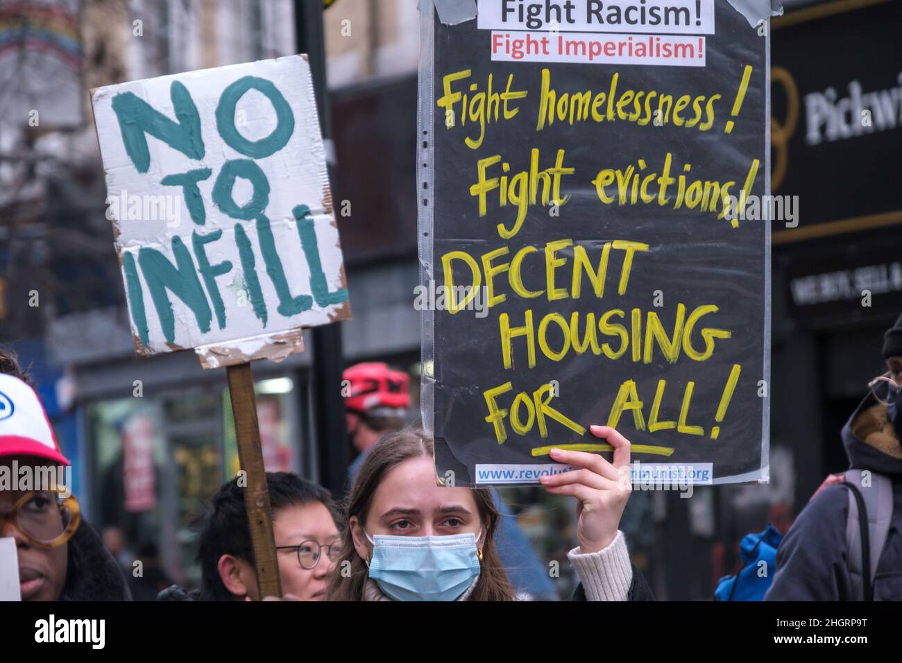 London, UK. 22nd Dec 2022. The Revolutionary Communist Group and other housing activists protest in the busy streets of Peckham calling for safe, decent and secure housing at reasonable rents for all. Southwark's Labour Council has demolished thousands of council homes, selling off land and homes for development almost entirely for private rent or sale, with little at social rents despite over 16,000 families on the council waiting list and 3,300 in temporary accommodation. Peter Marshall/Alamy Live News Stock Photo