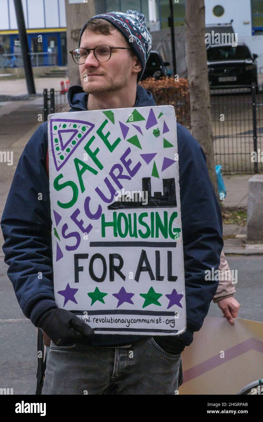 London, UK. 22nd Dec 2022. The Revolutionary Communist Group and other housing activists protest in the busy streets of Peckham calling for safe, decent and secure housing at reasonable rents for all. Southwark's Labour Council has demolished thousands of council homes, selling off land and homes for development almost entirely for private rent or sale, with little at social rents despite over 16,000 families on the council waiting list and 3,300 in temporary accommodation. Peter Marshall/Alamy Live News Stock Photo