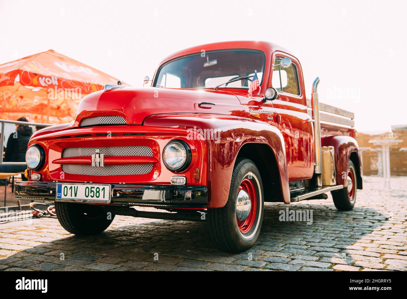 Front View Of Red International Harvester R-series Truck Parked In Street. Stock Photo