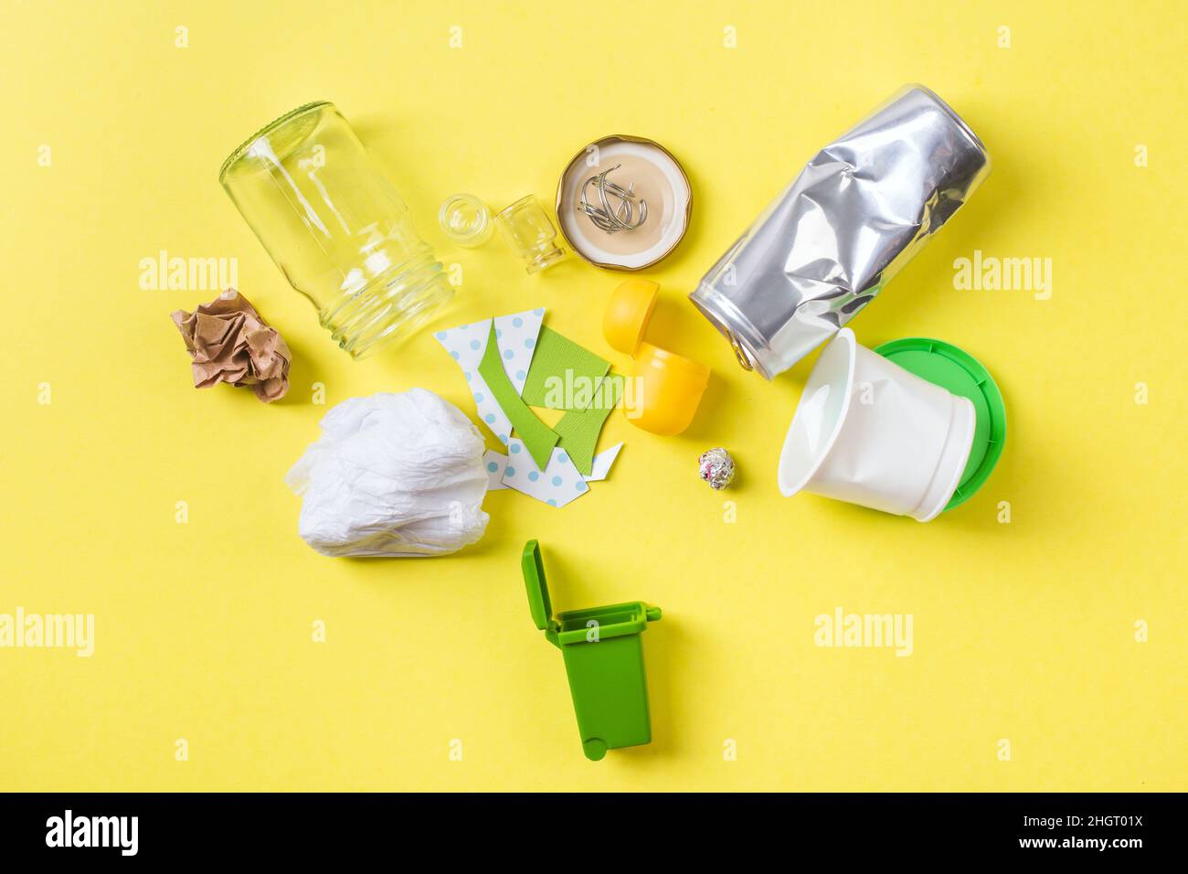 Clean trash to recycle in small bin metal, plastic paper and glass