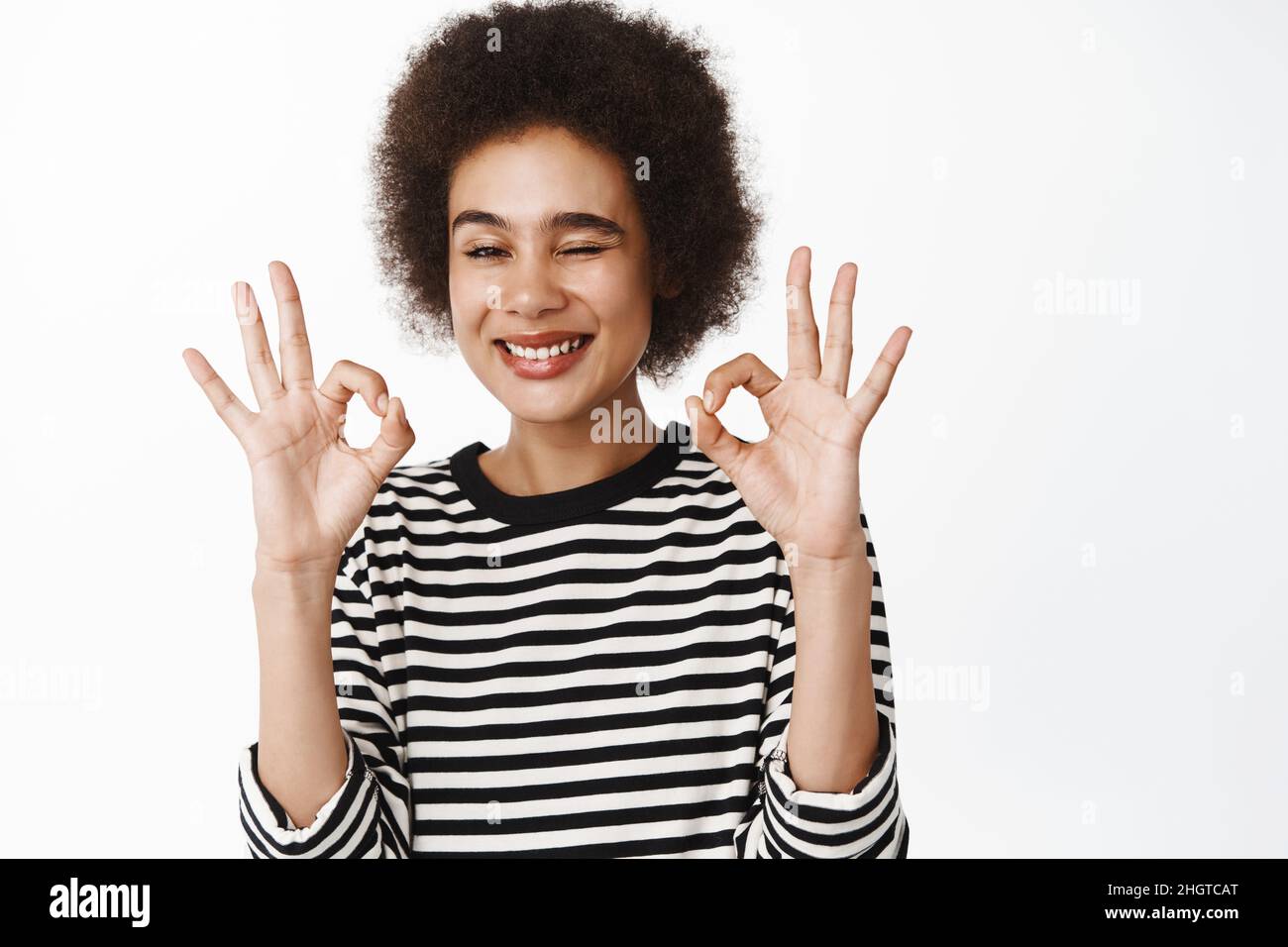 Portrait of beautiful black girl showing zero, okay sign, complimenting ...