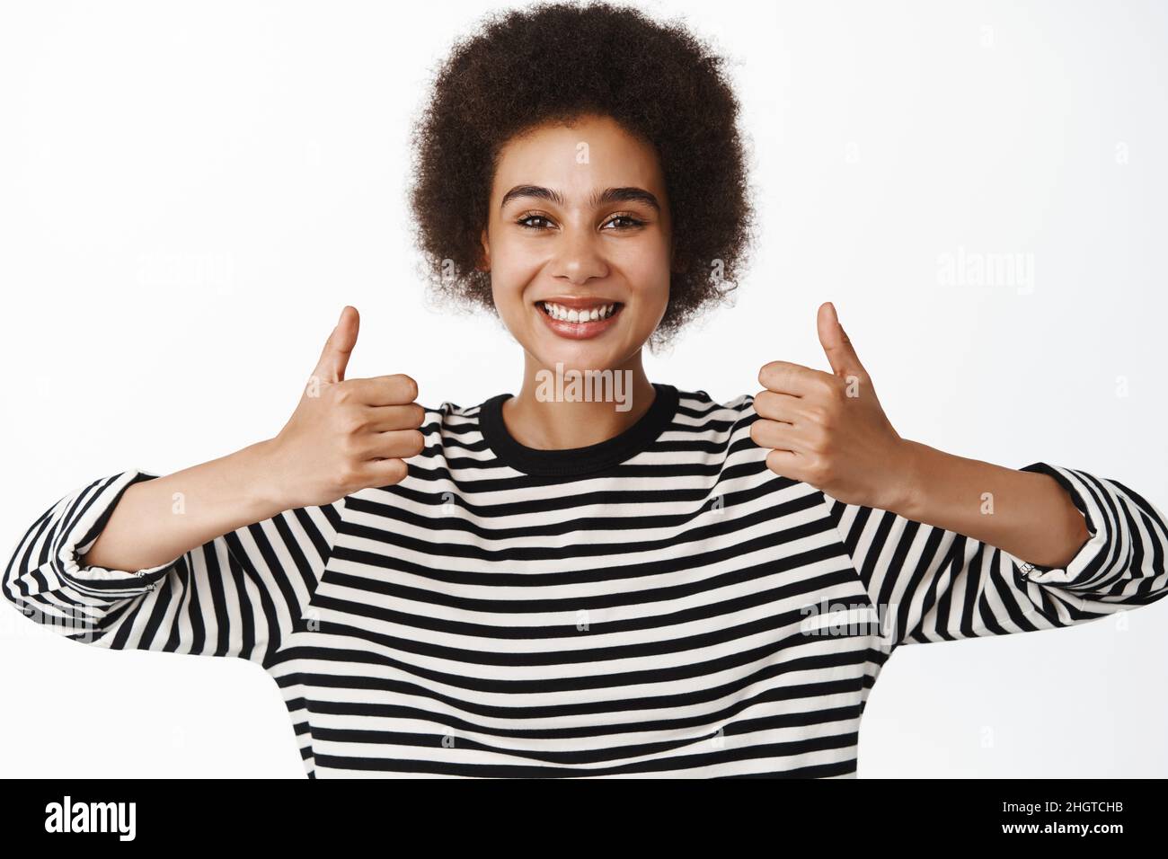 Image of smiling black girl showing thumbs up in approval, like and ...