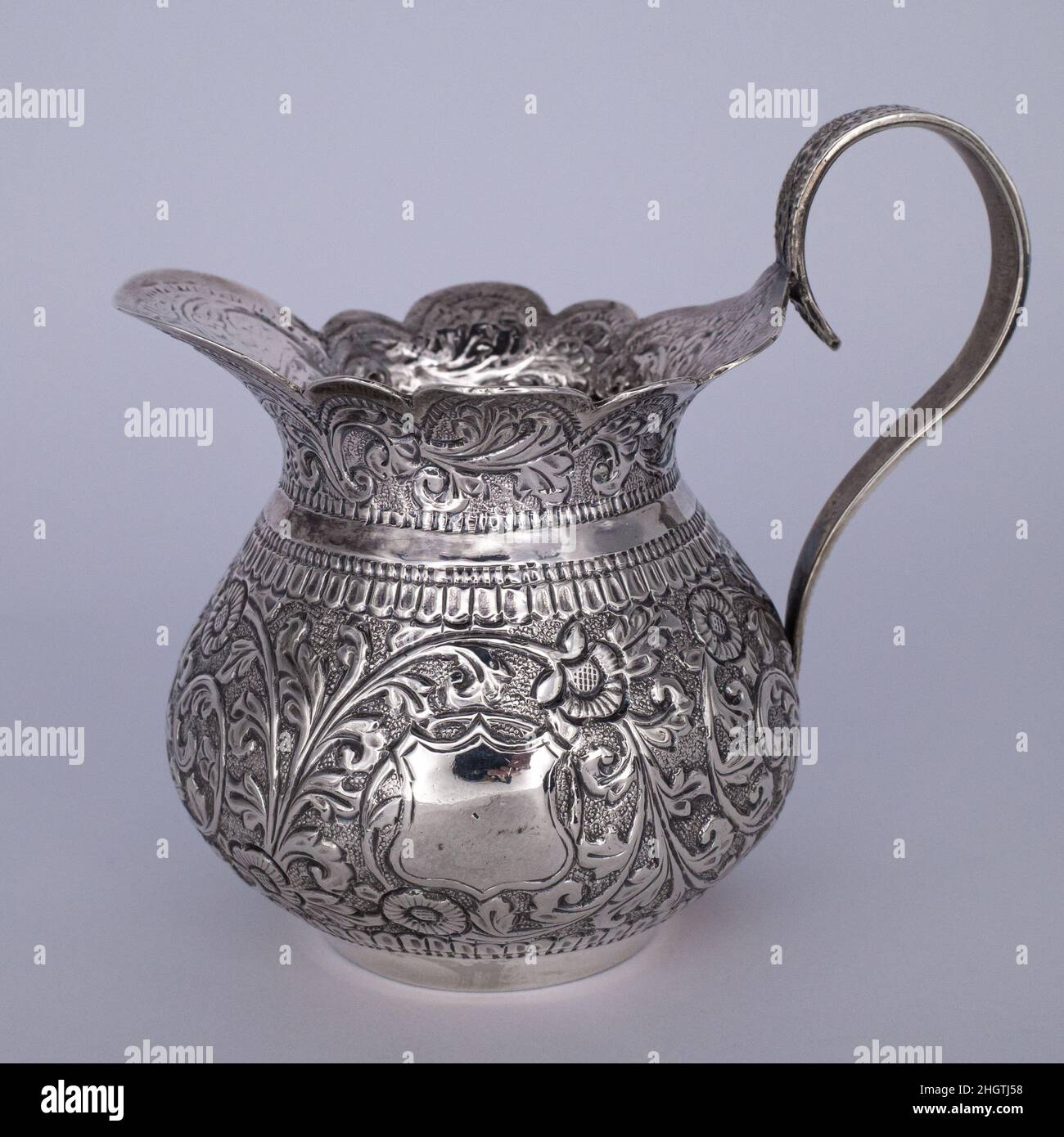 Antique Indian Raj Kutch Silver Repousse Cream Jug. Early 20th Century, Marked / Stamped. Stock Photo