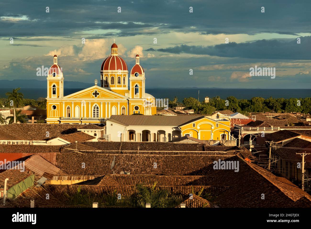 The beautiful neoclassical Granada Cathedral  and the roofs of colonial Granada, Nicaragua Stock Photo