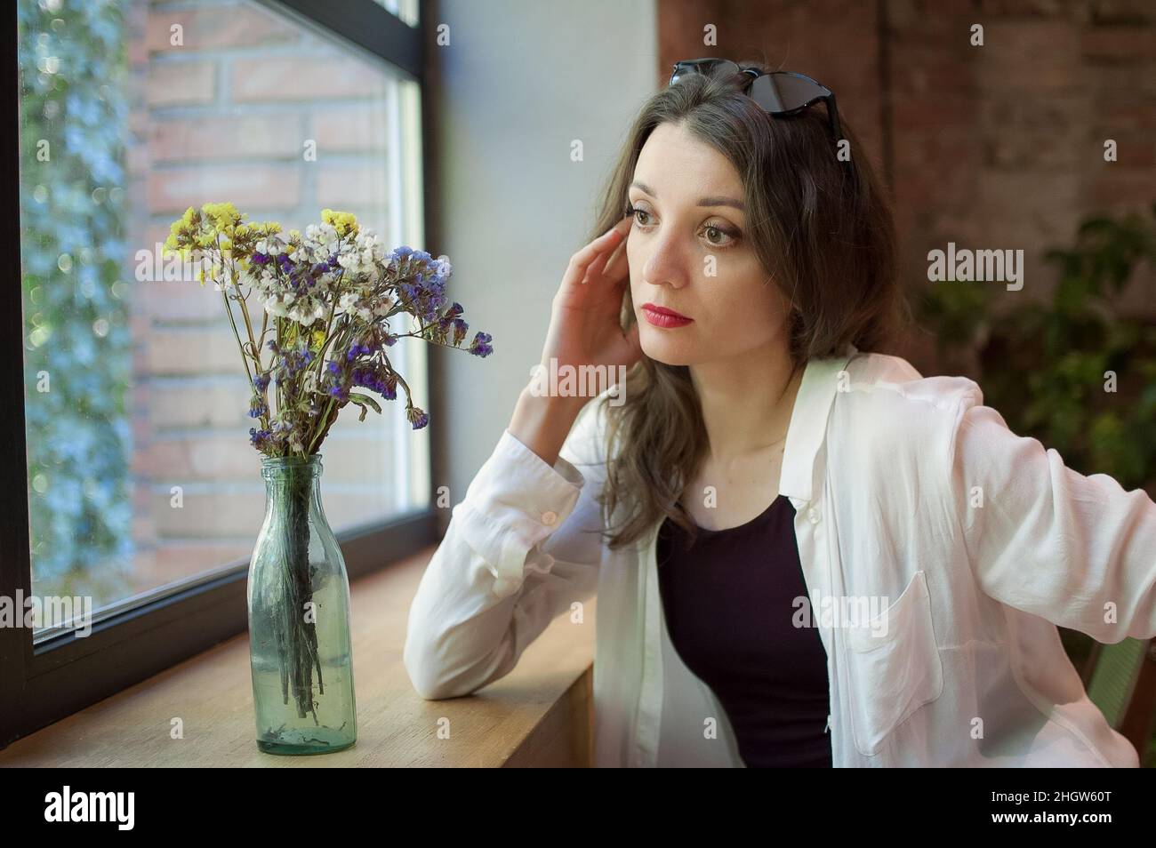 Woman in black top indoors hi-res stock photography and images - Alamy