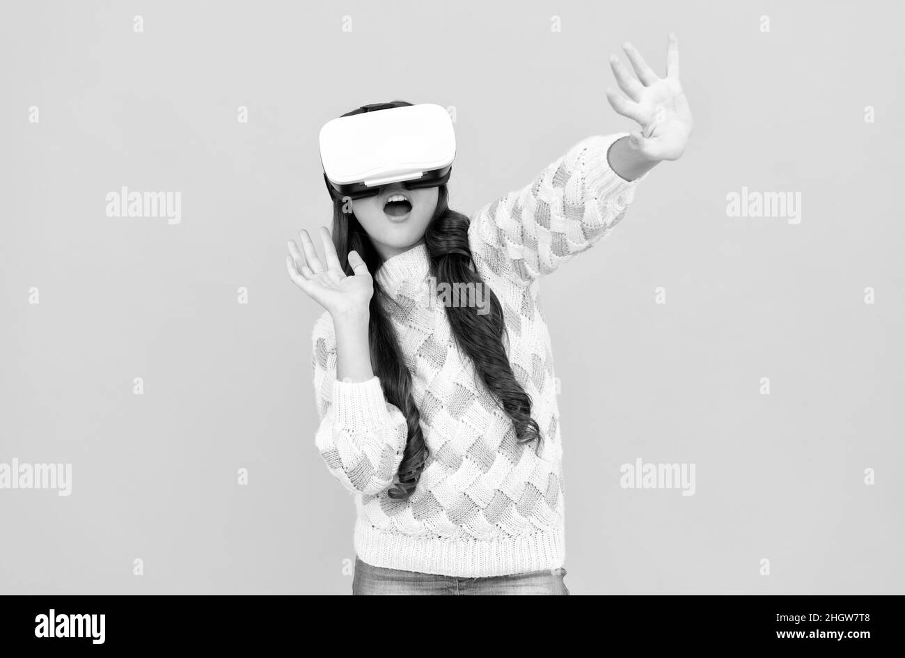 happy teen girl wear vr glasses using future technology for education in virtual reality, experience Stock Photo