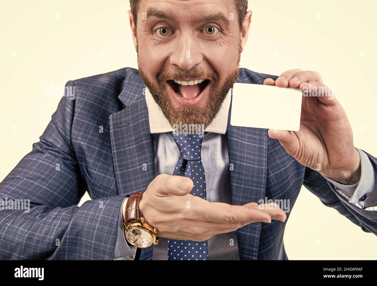 just look over there. businessman presenting credit or debit card. happy ceo Stock Photo