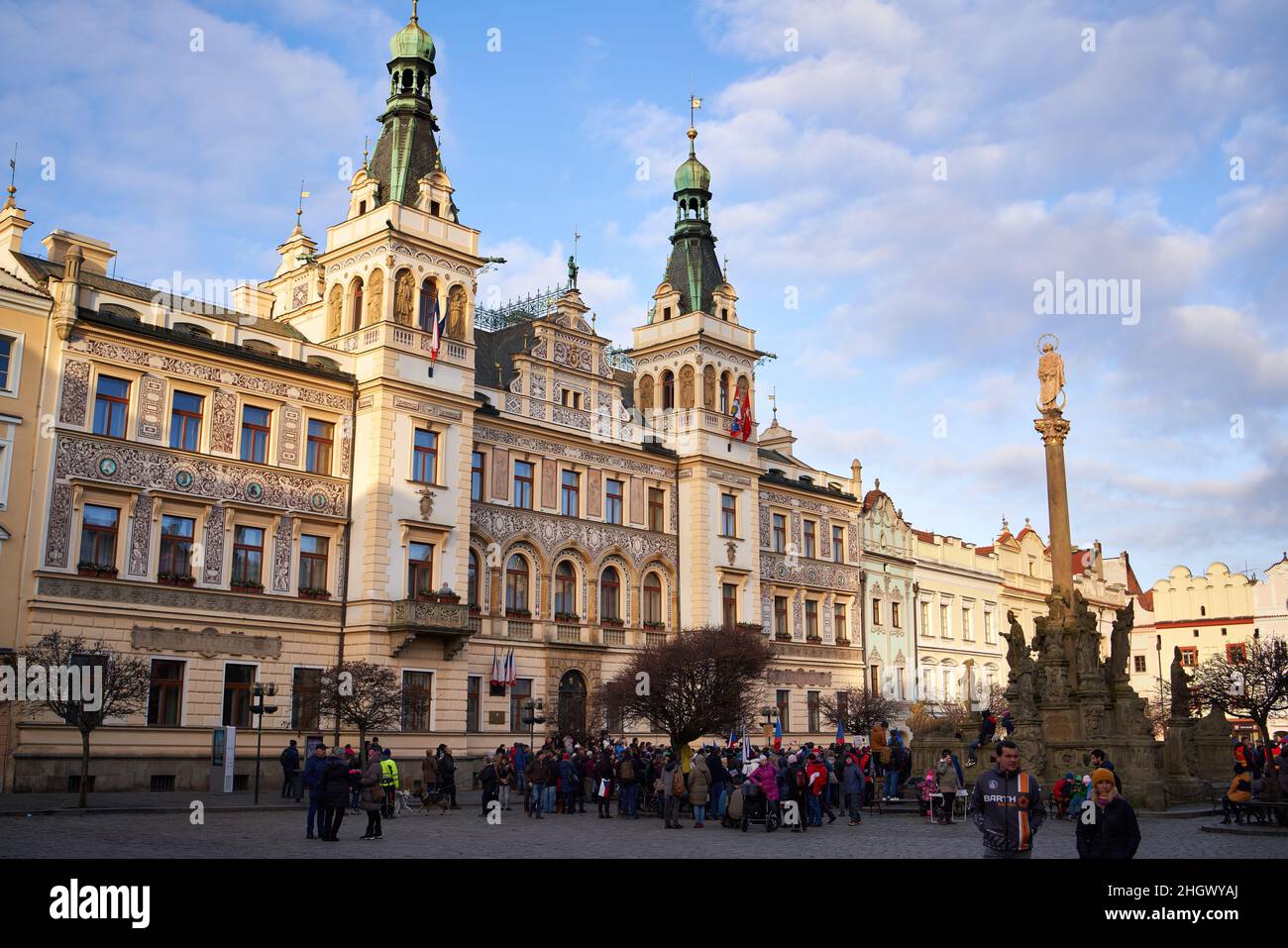 PARDUBICE, CZECH REPUBLIC - jANUARY 15, 2022: Town hall and people at an anti-vaccine demonstration during coronavirus pandemic Stock Photo