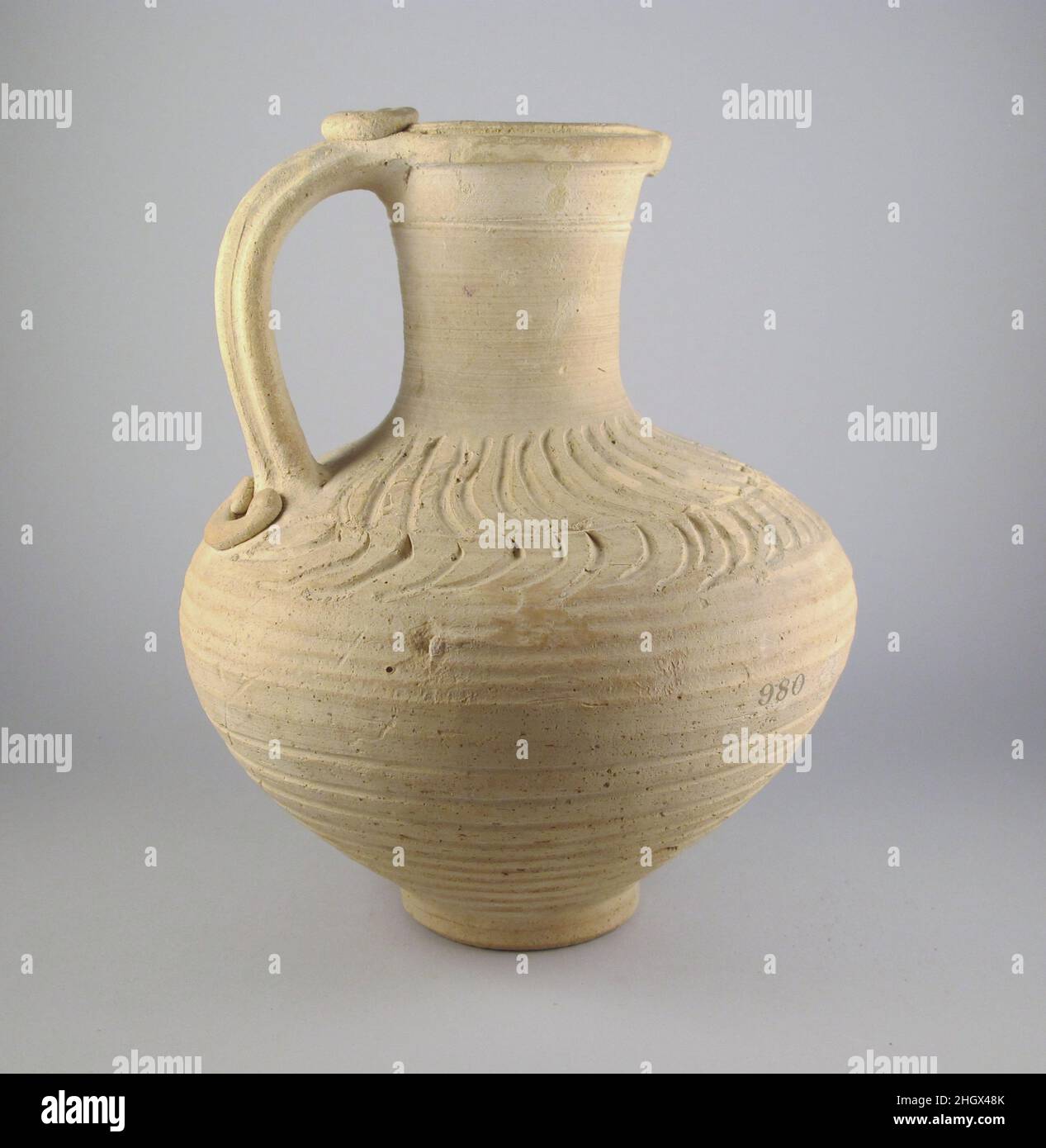 Terracotta jug Cypriot Jug with incised crescent ornament, of unpainted clay.. Terracotta jug