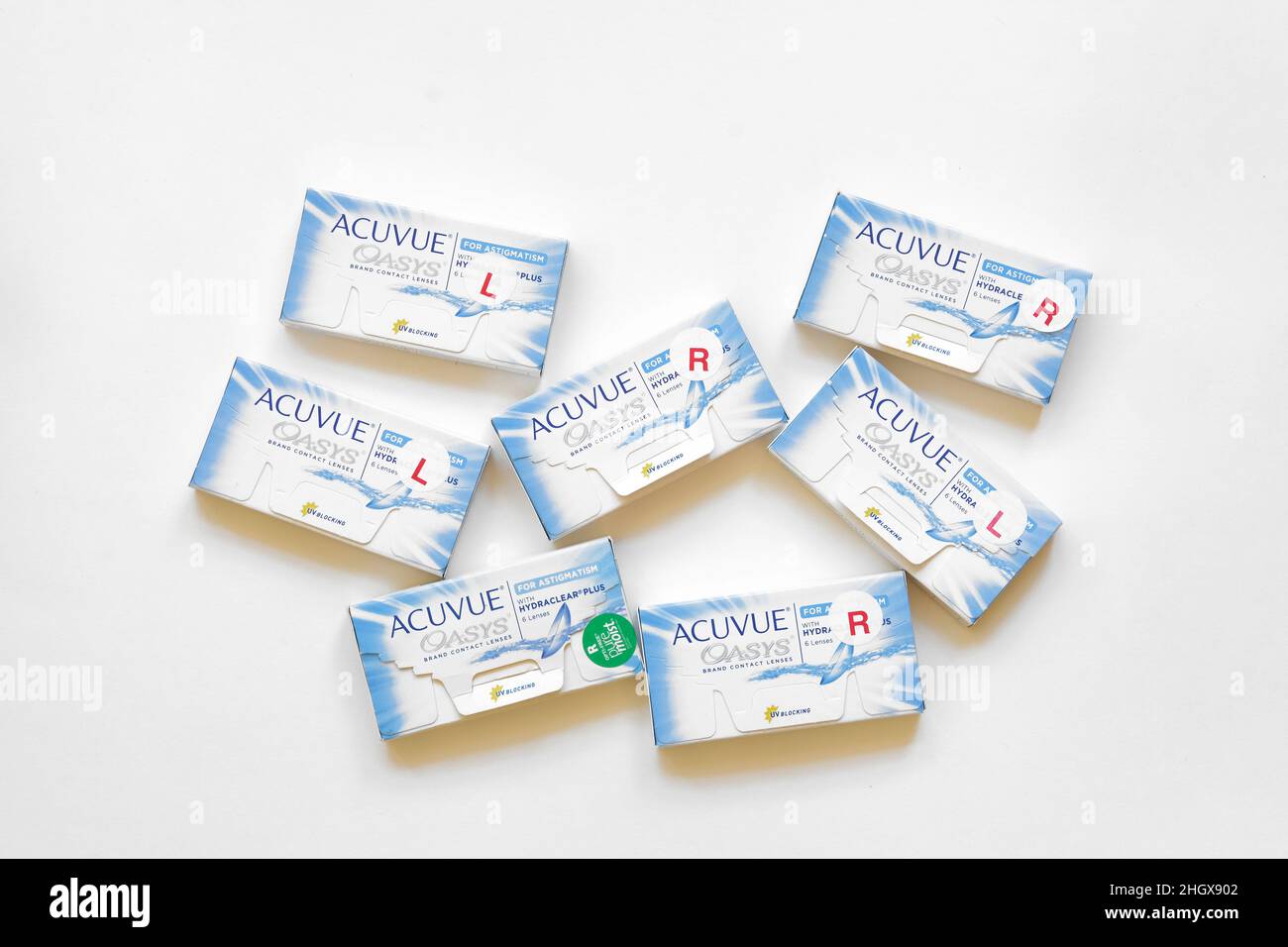 Boxes of Acuvue Oasys Brand Contact Lenses for astigmatism on a white