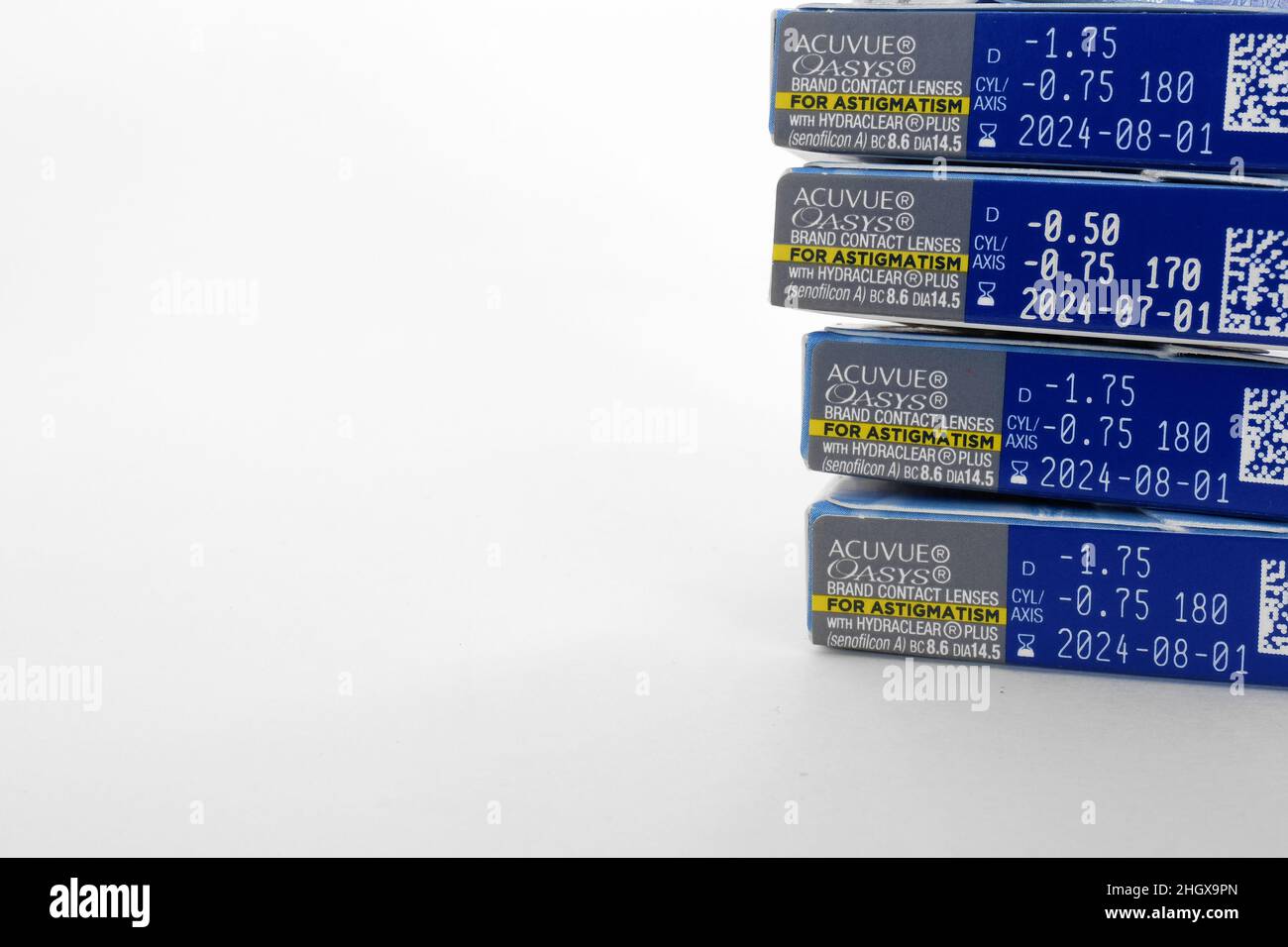 Boxes of Acuvue Oasys Brand Contact Lenses for astigmatism on a white